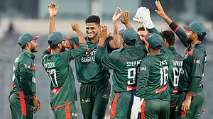 AP Photo : Bangladesh's Nahid Rana celebrates with teammates the wicket of Australia's Liam Scott during the first one day international cricket match between Australia and Bangladesh in Mirpur.
