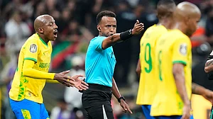 (AP Photo/Mosa'ab Elshamy, File) : FILE - Referee Omar Artan, center, signals a penalty during the CAF Champions League final soccer match between AS FAR Rabat and Mamelodi Sundowns, in Rabat, Morocco, Sunday, May 24, 202