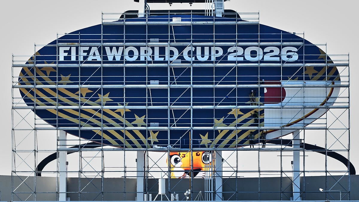 Workers cover a Kansas City Chiefs sign to FIFA World Cup 2026 as work continues to transform Arrowhead Stadium to Kansas City Stadium ahead of the FIFA World Cup soccer tournament. - AP Photo