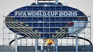 AP Photo : Workers cover a Kansas City Chiefs sign to FIFA World Cup 2026 as work continues to transform Arrowhead Stadium to Kansas City Stadium ahead of the FIFA World Cup soccer tournament.