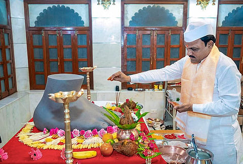 A member of the Lalbaugcha Raja Sarvajanik Ganeshotsav Mandal performs the 'Paduka Pujan', at Hanuman Temple, in Mumbai, Maharashtra. 