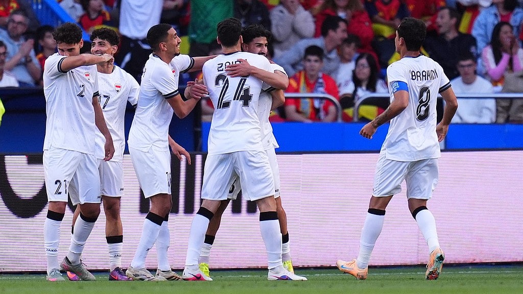 Iraq players celebrate their first goal against Spain during an international friendly soccer match in A Coruna, Spain. - AP Photo