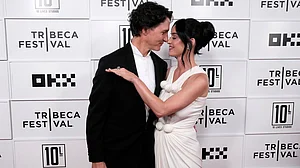 (Photo by Charles Sykes/Invision/AP) : Justin Trudeau, left, and Katy Perry attend the "Katy Perry: The Lifetimes Tour - Live from Paris" world premiere at the OKX Theater at BMCC Tribeca Performing Arts Center during the Tribeca Festival on Monday, May 8, 2026, in New York.