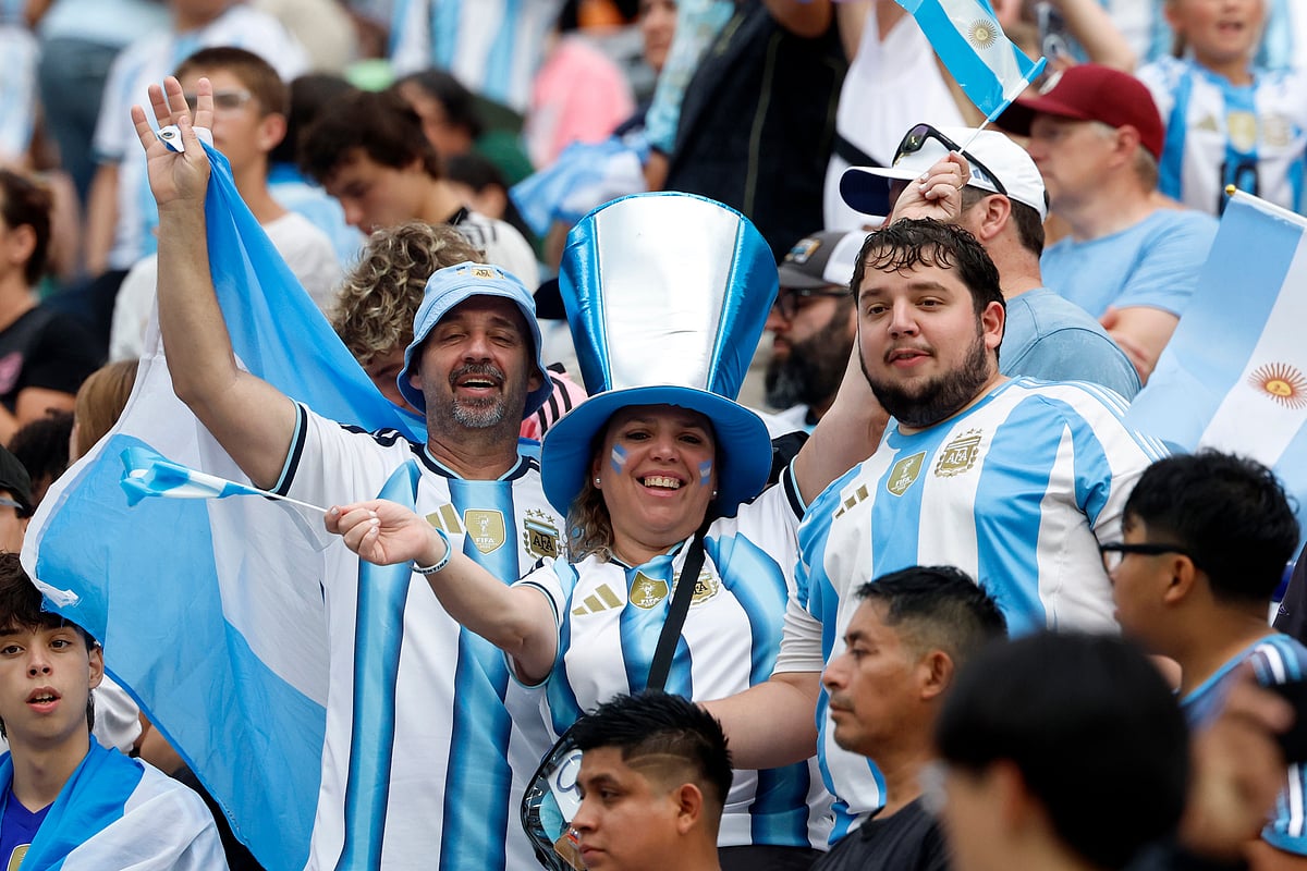 Fans cheer before the first half of an international friendly match between Argentina and Iceland - AP/Butch Dill