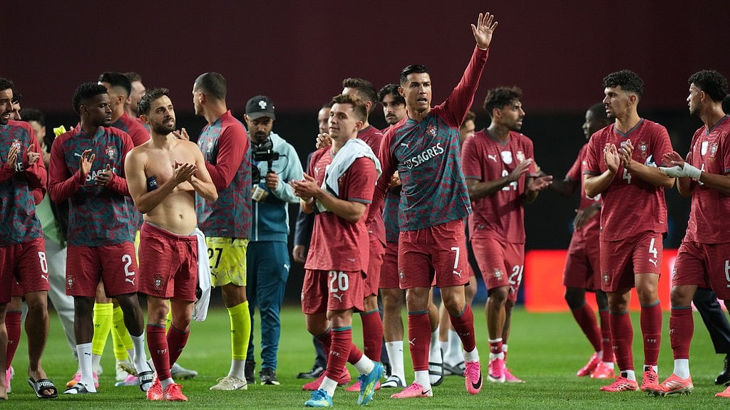 Portugal players walk off the pitch after an international friendly soccer match between Portugal and Nigeria in Leiria, Portugal, Wednesday. - AP Photo