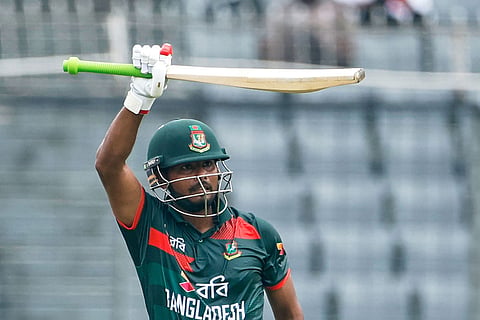 Bangladesh's Mosaddek Hossain Saikat celebrates his fifty runs during the first one day international cricket match between Australia and Bangladesh in Mirpur, Bangladesh.