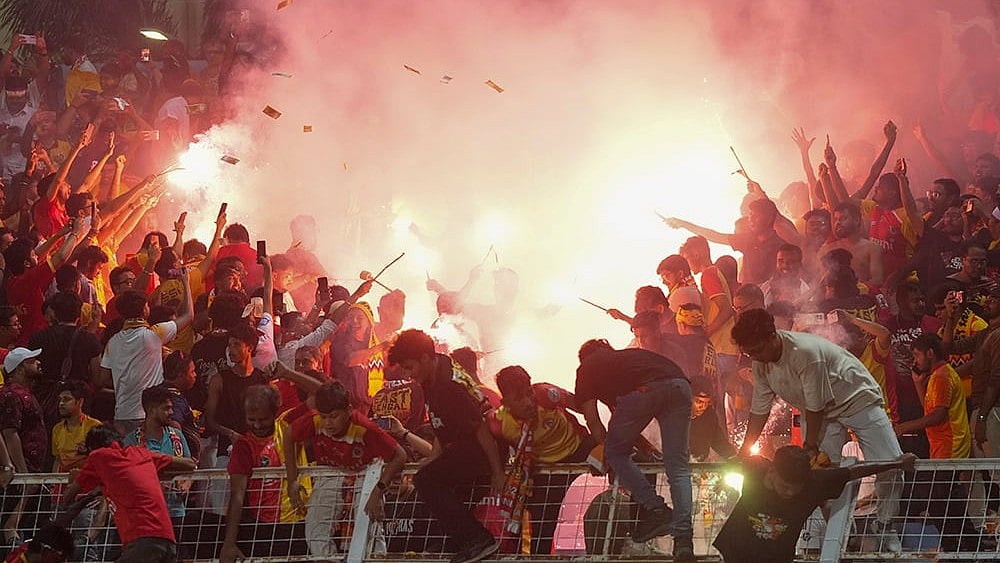East Bengal supporters celebrate with firecrackers after their team’s victory in the Indian Super League (ISL) 2026 football match against Inter Kashi, in Kolkata.
 - | Photo: PTI/Swapan Mahapatra