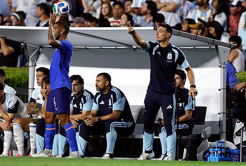 Argentina coach Lionel Scaloni directs players during the first half of an international friendly soccer match against Iceland in Auburn, Alabama.