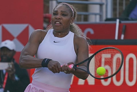 Serena Williams of the United States, hits a return as she and playing partner Victoria Mboko of Canada play against Nicole Melichar-Martinez of Canada and Erin Routliffe of New Zealand during their first round doubles match at the Queen's Club tennis championships in London.