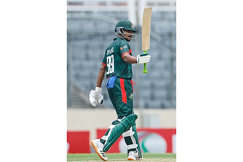 Bangladesh's Najmul Hossain Shanto celebrates his fifty runs during the first one day international cricket match between Australia and Bangladesh in Mirpur, Bangladesh.