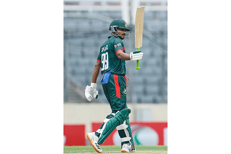 Bangladeshs Najmul Hossain Shanto celebrates his fifty runs