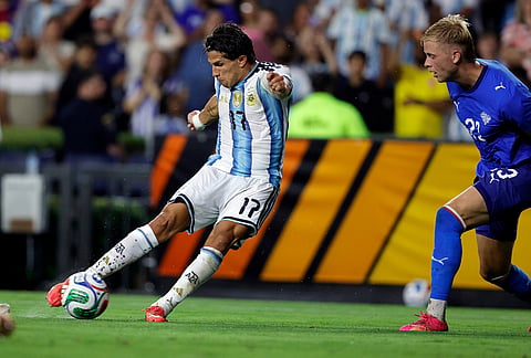 Argentina forward Giuliano Simeone (17) kicks an attempt on goal as Iceland Daniel Gudjohnsen (21) defends during the first half of an international friendly match, in Auburn, Alabama.