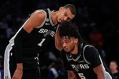San Antonio Spurs forward Victor Wembanyama (1) talks with guard Stephon Castle during second half of Game 3 of the NBA Finals basketball series against the New York Knicks in New York. - | Photo: AP/Ross D. Franklin