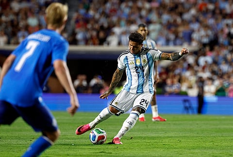 Argentina midfielder Enzo Fernández (24) kicks the ball during the second half of an international friendly match against Iceland, in Auburn, Alabama.