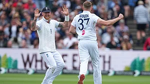 AP Photo : England's Gus Atkinson, right, celebrates with captain Ben Stokes after bowling out New Zealand's Matt Henry to win the Test match between England and New Zealand at Lord's cricket ground in London.