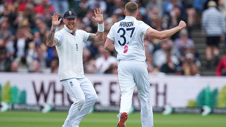 England's Gus Atkinson, right, celebrates with captain Ben Stokes after bowling out New Zealand's Matt Henry to win the Test match between England and New Zealand at Lord's cricket ground in London. - AP Photo
