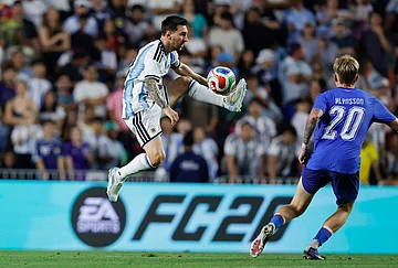 | Photo: AP/Butch Dill : Argentina forward Lionel Messi (10) gets control of the ball as Iceland midfielder Kristian Hlynsson (20) defends during the second half of an international friendly match soccer match in Auburn, Alabama.