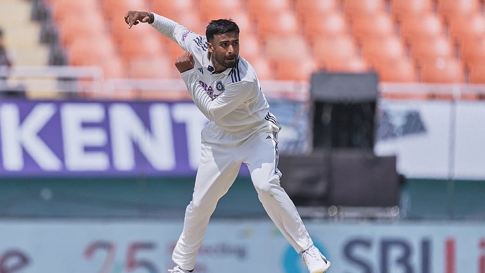 India's Manav Suthar bowls a delivery on day two of the cricket test match between Afghanistan and India in New Chandigarh. - | Photo: AP/Ashwini Bhatia