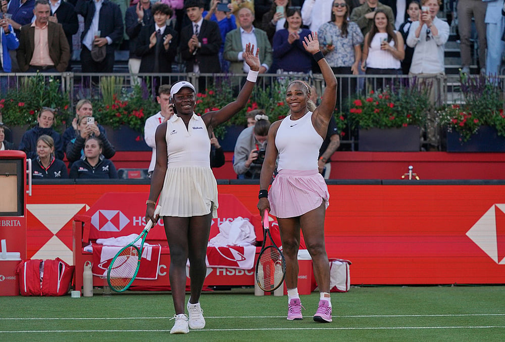 Serena Williams of the United States, celebrates with playing partner Victoria Mboko of Canada after defeating Nicole Melichar-Martinez of Canada and Erin Routliffe of New Zealand during their first round doubles match at the Queen's Club tennis championships in London. - | Photo: AP/Alberto Pezzali