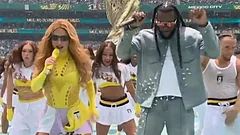 Shakira and Burna Boy performing at the opening ceremony. - X