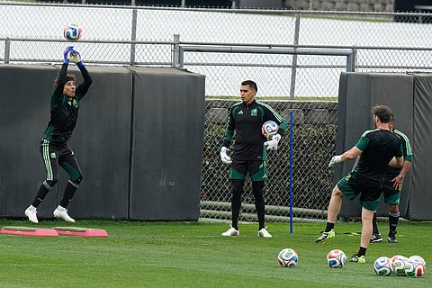 Mexico's goalkeeper Guillermo Ochoa stops shot during a training in Mexico City, ahead of Mexico's opening match against South Africa at the FIFA World Cup.