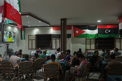 Football fans watch the opening match of the 2026 World Cup at a local coffee shop in Gaza Strip, Friday June 11, 2026.