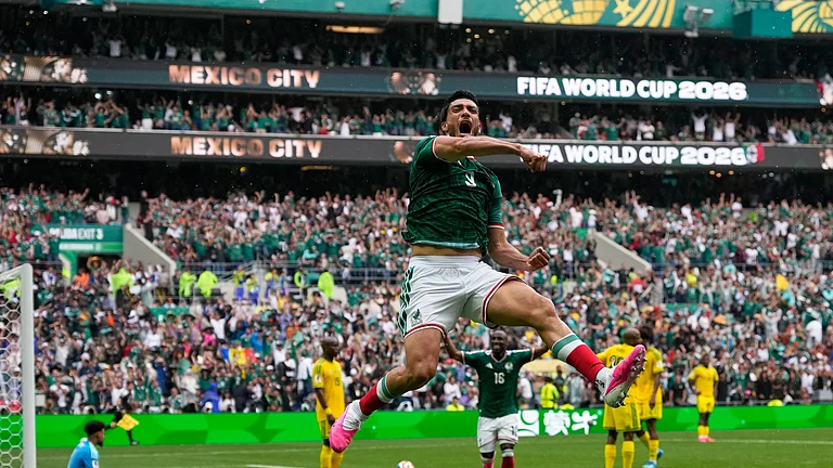 Mexico's Raul Jimenez celebrates after scoring his side's second goal during the World Cup Group A soccer match between Mexico and South Africa in Mexico City, Thursday, June 11, 2026. - (AP Photo/Natacha Pisarenko)