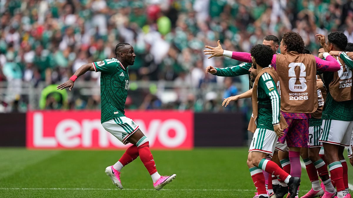 (AP Photo/Natacha Pisarenko) : Mexico's Julian Quinones, left, celebrates after scoring the opening goal during the World Cup Group A soccer match between Mexico and South Africa in Mexico City, Thursday, June 11, 2026. 