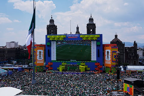 Fans watch the opening match of the 2026 FIFA World Cup between Mexico and South Africa at a fan festival in the Zocalo, Mexico City's main square, Thursday, June 11, 2026.