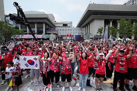 Korean fans cheer for their team as they watch a live public broadcast of the FIFA World Cup 2026, Group A match between South Korea and Czechia in Mexico, at a public viewing venue in Seoul, South Korea, Friday, June 12, 2026.