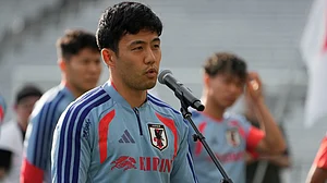 (AP Photo/George Walker IV) : Japan's Wataru Endo addresses fans before a training session Monday, June 8, 2026, in Nashville, Tenn., ahead of the World Cup soccer tournament