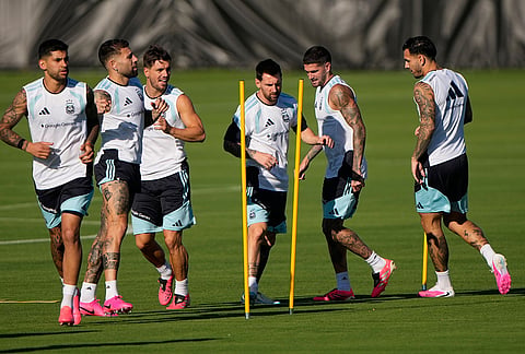 Argentina's Lionel Messi, fourth from left, practices with teammates for the FIFA World Cup soccer tournament in Kansas City, Kansas.