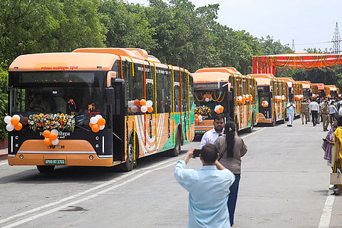 Electronic buses decorated during the virtual inauguration of Noida city bus service by Uttar Pradesh Chief Minister Yogi Adityananath, unseen, in Gautam Buddh Nagar district.