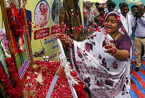 | Photo: PTI : Sita Ben Patni, mother of Akash Patni who died in the Air India AI-171 plane crash on June 12, 2025, mourns as she pays tribute to her son at the crash site on its first anniversary, in Ahmedabad, Gujarat.
