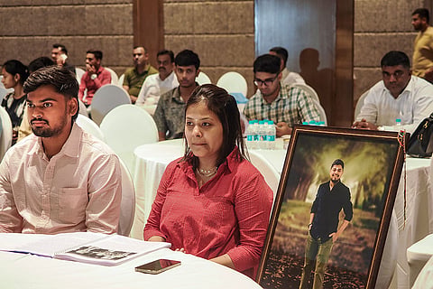 Family members of victims of the Air India AI-171 plane crash attend 'A Day of Remembrance, Unity And Justice' event organised on the first anniversary of the tragedy, in Ahmedabad, Gujarat.