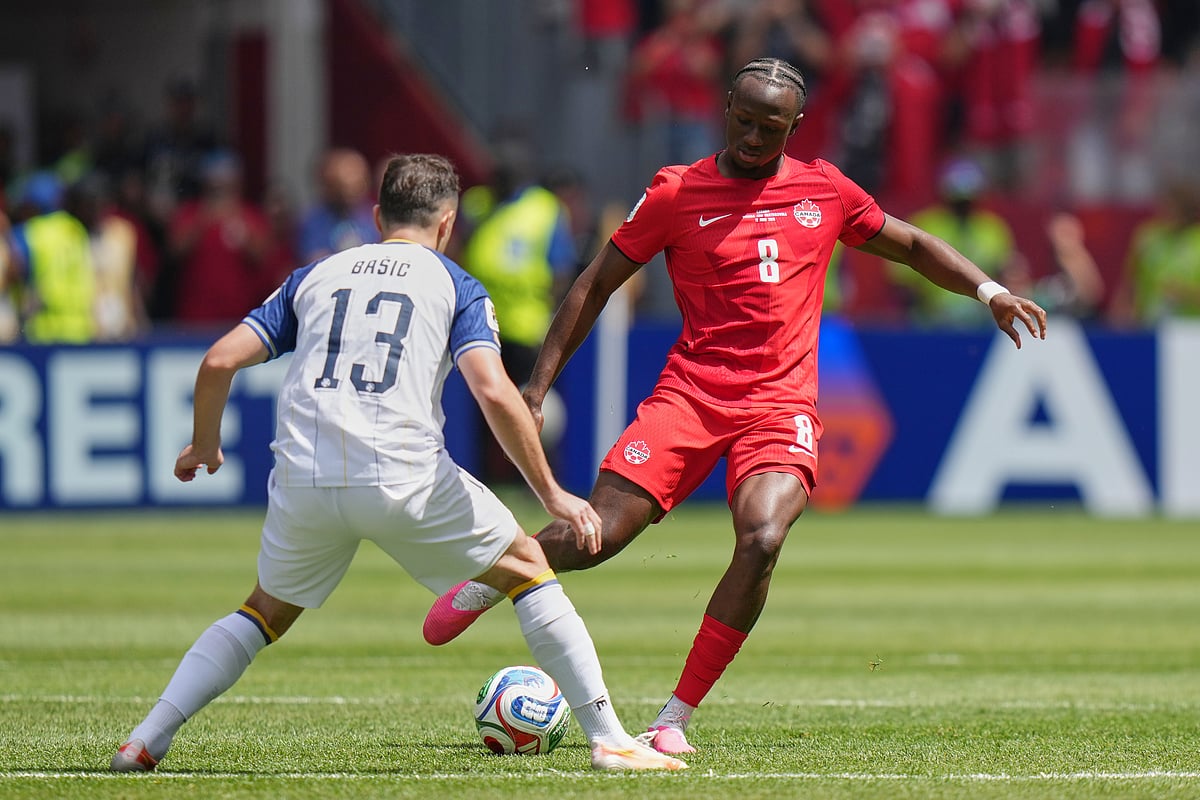Bosnia's Ivan Basic, left, challenges Canada's Ismael Kone for the ball during the World Cup Group B soccer match between Canada and Bosnia in Toronto, Friday, June 12, 2026.  - AP Photo/Stephanie Scarbrough
