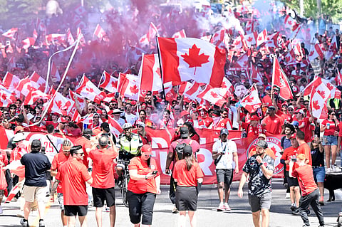 Members of the Voyageurs, Canada’s national team supporters, march toward Toronto Stadium ahead of the FIFA World Cup 2026, Group B match between Canada and Bosnia, Friday, June 12, 2026, in Toronto