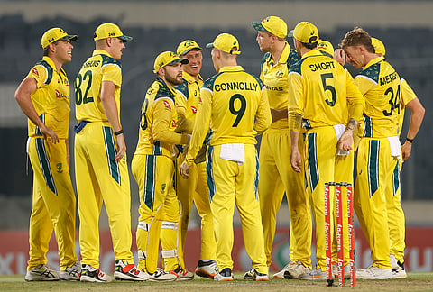 Australia's players celebrate the wicket of Bangladesh's Najmul Hossain Shanto during the second one day international cricket match between Australia and Bangladesh in Mirpur, Bangladesh.