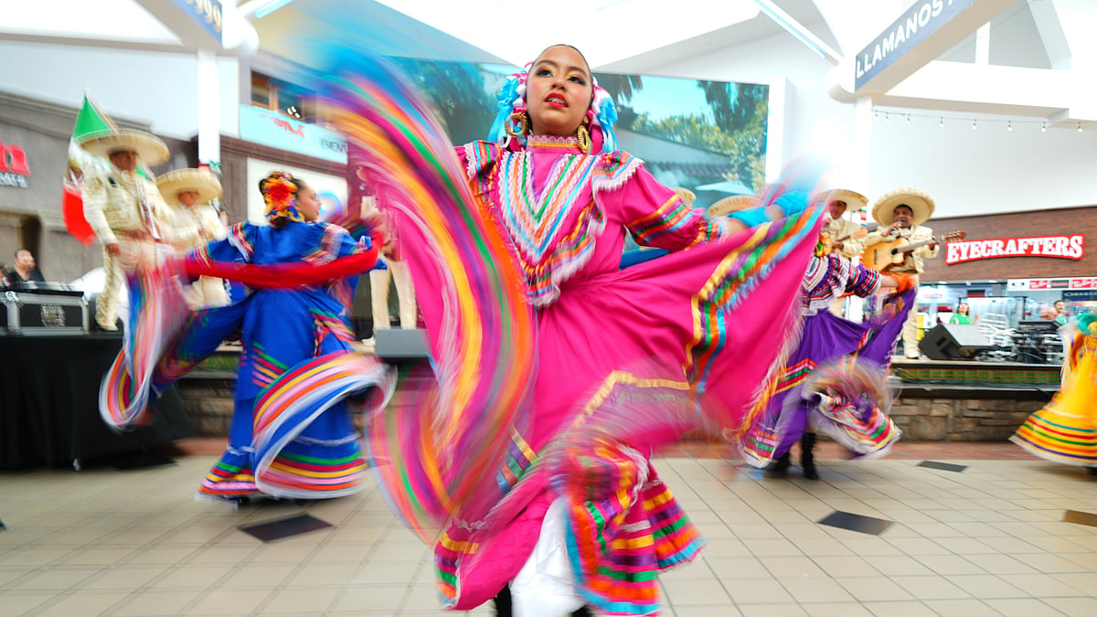 Sara Contreras dances with members of Ballet FolklÛrico Azteca of Fort Worth during a FIFA World Cup soccer tournament opening match watch party, Thursday, June 11, 2026, in Fort Worth, Texas.  - (AP Photo/Julio Cortez)