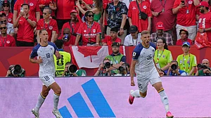 (AP Photo/Stephanie Scarbrough) : Bosnia's Jovo Lukic, right, celebrates after he scores the opening goal during the World Cup Group B soccer match between Canada and Bosnia in Toronto, Friday, June 12, 2026.