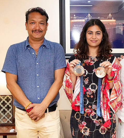 Jaspal Rana, one of India's finest pistol shooters who made a hugely successful transition to coaching and guided Manu Bhaker to epoch-making twin bronze medals at the Paris Olympics, has shockingly died at a mere 49 years of age after battling cardiac complications on Thursday night, June 11, 2026. Rana, left, and Bhaker are seen during an interview with PTI, in New Delhi, in this file photo dated Friday, Aug. 16, 2024. 