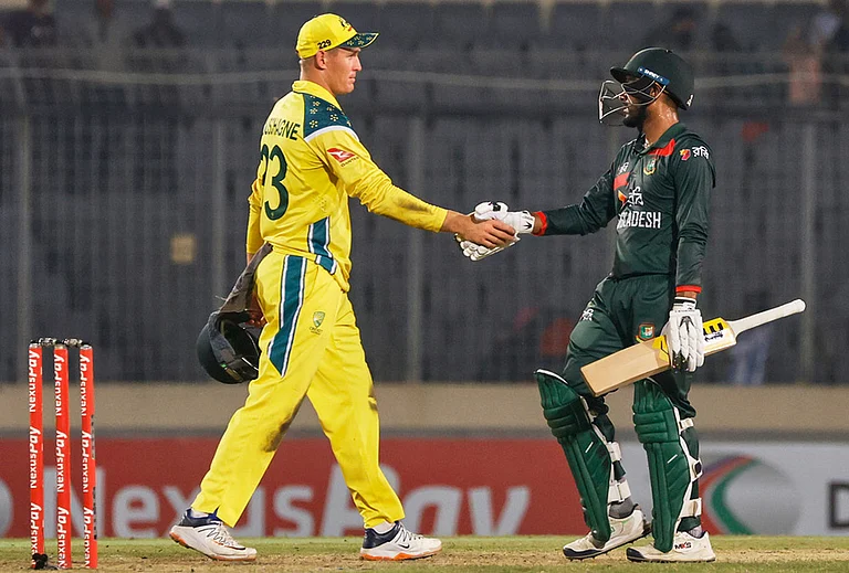 Bangladesh's captain Mehidy Hasan Miraz shakes hands with Australia's Marnus Labuschagne after winning the second one day international cricket match against Australia in Mirpur, Bangladesh. - | Photo: AP/Mosaraf Hossain