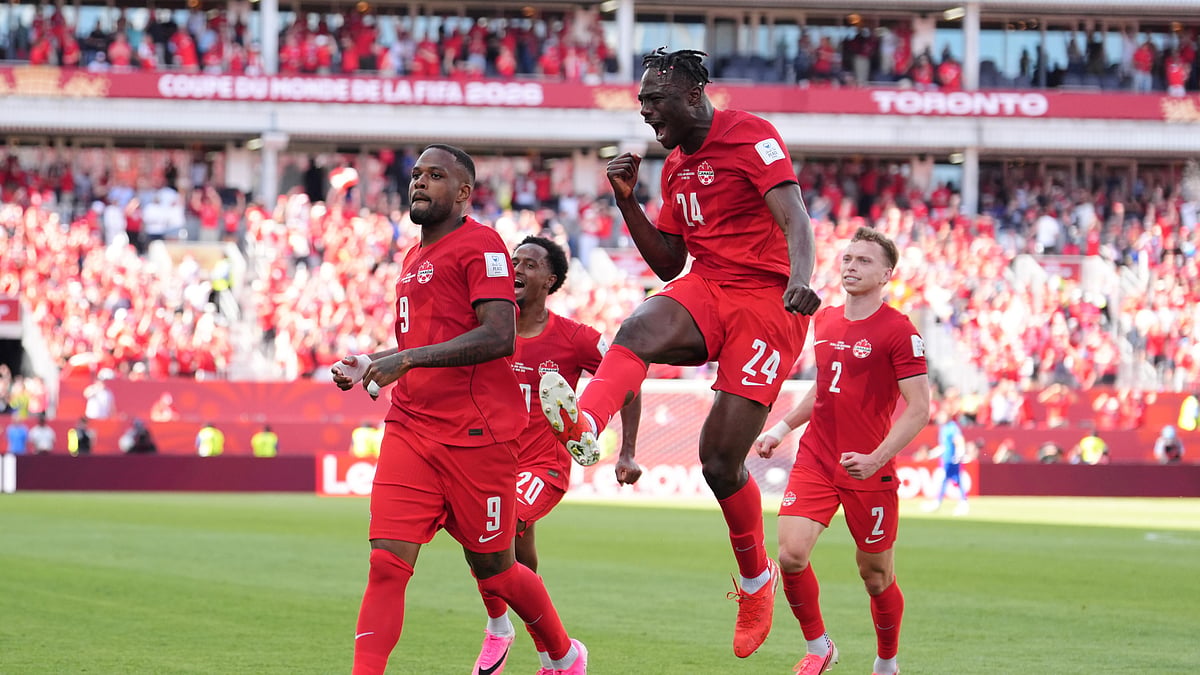 Canada's Cyle Larin (9) celebrates after scoring his sides first goal of the game with Promise David (24) in the second half of the World Cup Group B soccer match between Canada and Bosnia, Friday, June 12, 2026, in Toronto. - (AP Photo/Sam Balkansky)