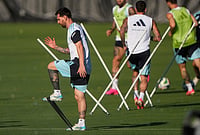 | Photo: AP/Charlie Riedel : Argentina's Lionel Messi, left, practices with teammates for the FIFA World Cup soccer tournament in Kansas City, Kansas.