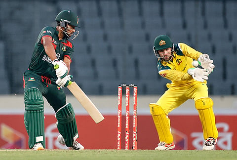 Australia's captain Josh Inglis collects the during the second one day international cricket match between Australia and Bangladesh in Mirpur, Bangladesh.