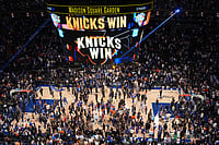 | Photo: AP/Frank Franklin II : Players and fans celebrate after the New York Knicks' victory over the San Antonio Spurs in Game 4 of the NBA Finals basketball series in New York.