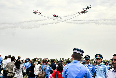 The Indian Air Force's Sarang Helicopter Display Team performs during the Combined Graduation Parade (CGP) at the Air Force Academy, in Hyderabad, Telangana.