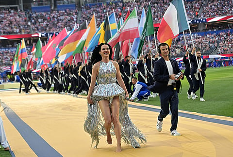 Katy Perry heads off the stage after performing before the start of the World Cup Group D soccer match between Paraguay and the United States in Inglewood, California, near Los Angeles.