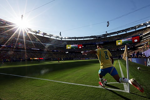 Brazil's Bruno Guimaraes (8) takes a corner kick in the first half during the World Cup Group C soccer match between Brazil and Morocco in East Rutherford, N.J., near New York, Saturday, June 13, 2026.
