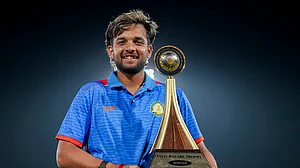 | Photo: PTI/Shailendra Bhojak : Vidarbha's captain Harsh Dubey poses with the trophy after Vidarbha won the Vijay Hazare Trophy 2025-26, at BCCI Centre of Excellence, in Bengaluru, Karnataka.